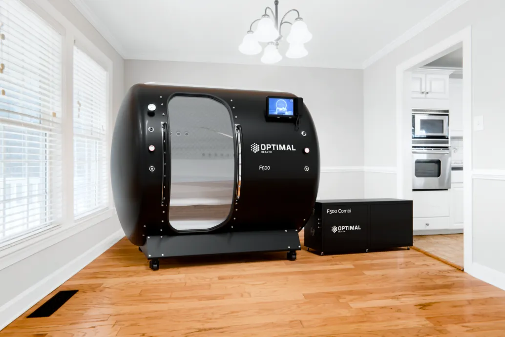 AeroVita seated steel chamber in a clinical wellness setting